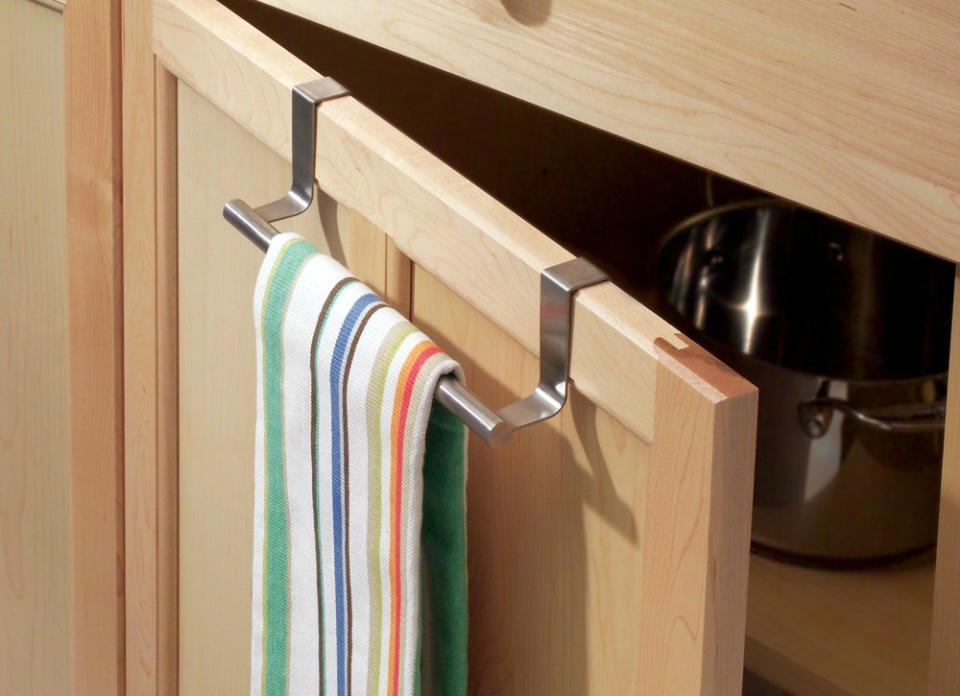 <body> <p>Hooks and towel bars offer countless customizable ways to take advantage of the unused <a rel="nofollow noopener" href=" http://www.bobvila.com/slideshow/don-t-make-these-7-mistakes-in-small-spaces-48562?bv=yahoo" target="_blank" data-ylk="slk:space;elm:context_link;itc:0;sec:content-canvas" class="link ">space</a> on almost any surface. Attach one to the inside of a cabinet to hold dish towels or pot lids, run a few across an empty stretch of wall to hold coffee mugs or often-used cooking utensils, or stick magnetic hooks on the side of the fridge to keep your favorite apron or oven mitts close at hand. <em>Available on <a rel="nofollow noopener" href=" http://www.amazon.com/InterDesign-Forma-Cabinet-Brushed-Stainless/dp/B000R2JZ4I/?_encoding=UTF8&camp=1789&creative=9325&linkCode=ur2&tag=bovi01-20&linkId=QASVONIL3NUER53X" target="_blank" data-ylk="slk:Amazon;elm:context_link;itc:0;sec:content-canvas" class="link ">Amazon</a>; $10.</em> </p> <p><strong>Related: <a rel="nofollow noopener" href=" http://www.bobvila.com/slideshow/7-clever-ways-for-hooks-to-streamline-your-life-48763#.VXCDYGRViko?bv=yahoo" target="_blank" data-ylk="slk:7 Clever Ways for Hooks to Streamline Your Life;elm:context_link;itc:0;sec:content-canvas" class="link ">7 Clever Ways for Hooks to Streamline Your Life</a> </strong> </p> </body>