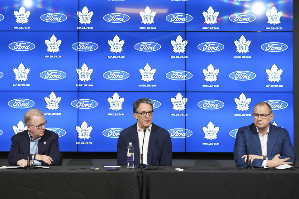 New Maple Leafs Sports & Entertainment president Keith Pelley, left, Maple Leafs president Brendan Shanahan, centre, and Maple Leafs general manager Brad Treliving speak to the media during an NHL hockey press conference in Toronto, Friday, May 10, 2024. (Nathan Denette/The Canadian Press via AP)