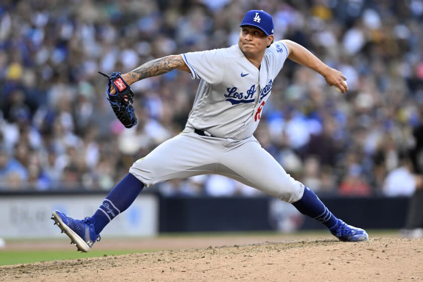 Los Angeles Dodgers relief pitcher Victor Gonzalez throws to a San Diego Padres batter during the eighth inning.