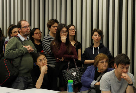 Students and faculty of the Hungary-based Central European University listen to the school's rector, Michael Ignatieff, address a town hall meeting after the government of Prime Minister Viktor Orban tabled a new bill that could force the 25-year-old school out of Hungary, in Budapest, Hungary March 29, 2017. REUTERS/Bernadett Szabo