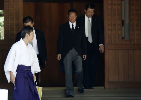 Japan's Internal Affairs and Communications Minister Yoshitaka Shindo leaves after visiting the Yasukuni Shrine in Tokyo August 15, 2014, to mark the 69th anniversary of Japan's surrender in World War Two. REUTERS/Yuya Shino