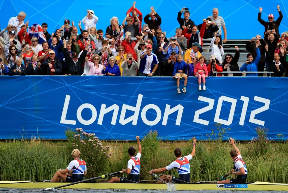 Great Britain’s men’s four of (left to right) Andrew Triggs Hodge, Tom James, Pete Reed and Alex Gregory are cheered by the crowd as they celebrate gold at Eton Dorney (Stephen Pond/PA) (PA Archive)