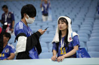 Japan team supporters react after the World Cup round of 16 soccer match between Japan and Croatia at the Al Janoub Stadium in Al Wakrah, Qatar, Monday, Dec. 5, 2022. (AP Photo/Eugene Hoshiko)