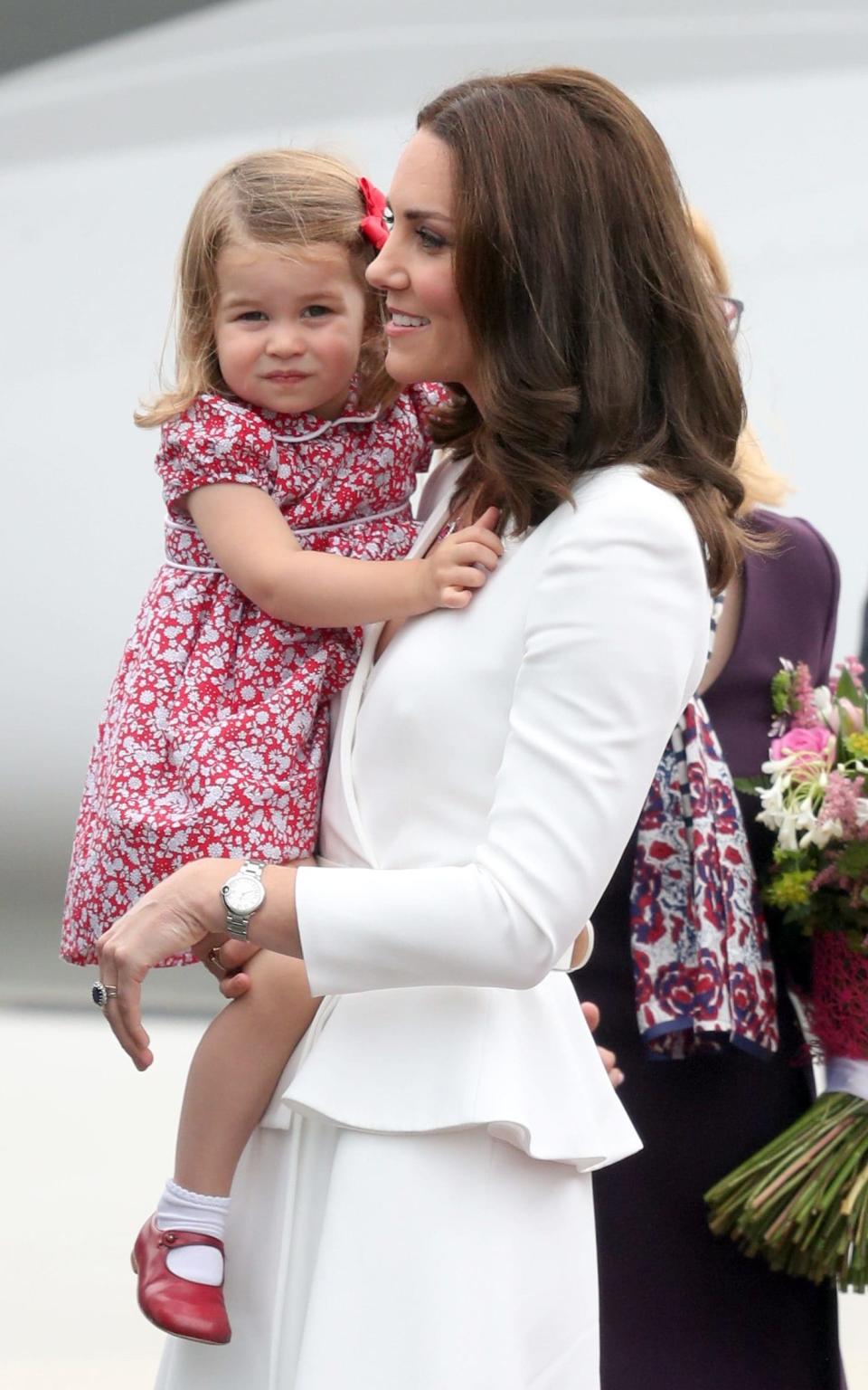 Kate and Charlotte's tributes to the Polish flag - Credit: PA