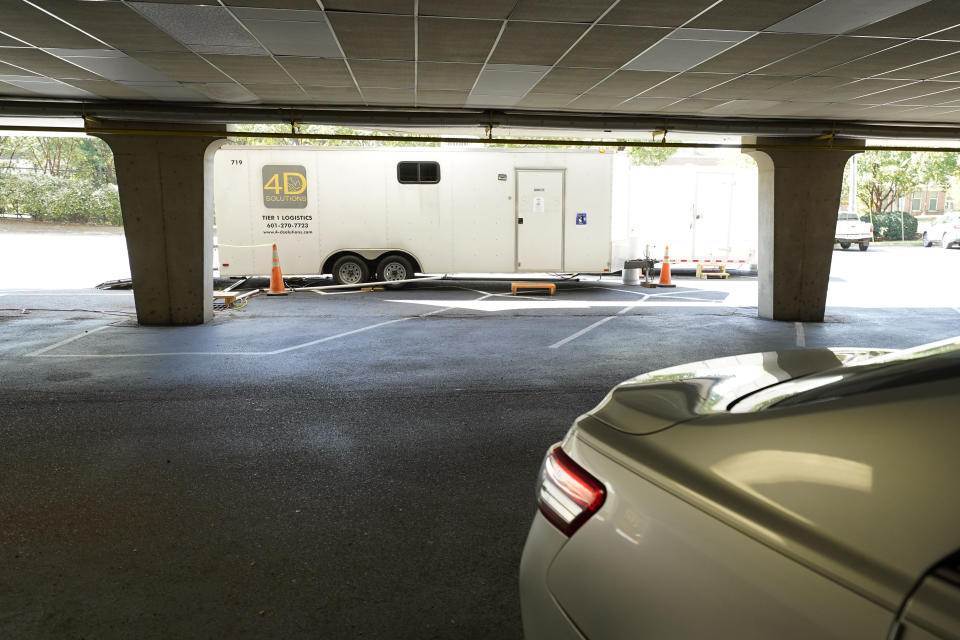 One set of portable showers and toilets are next to parking garage at the Millsaps College Gertrude C. Ford Academic Complex on the midtown Jackson, Miss., complex, Thursday, Sept. 1, 2022. The school rented them for the 200 students that remained on campus during the city's latest water crisis. (AP Photo/Rogelio V. Solis)