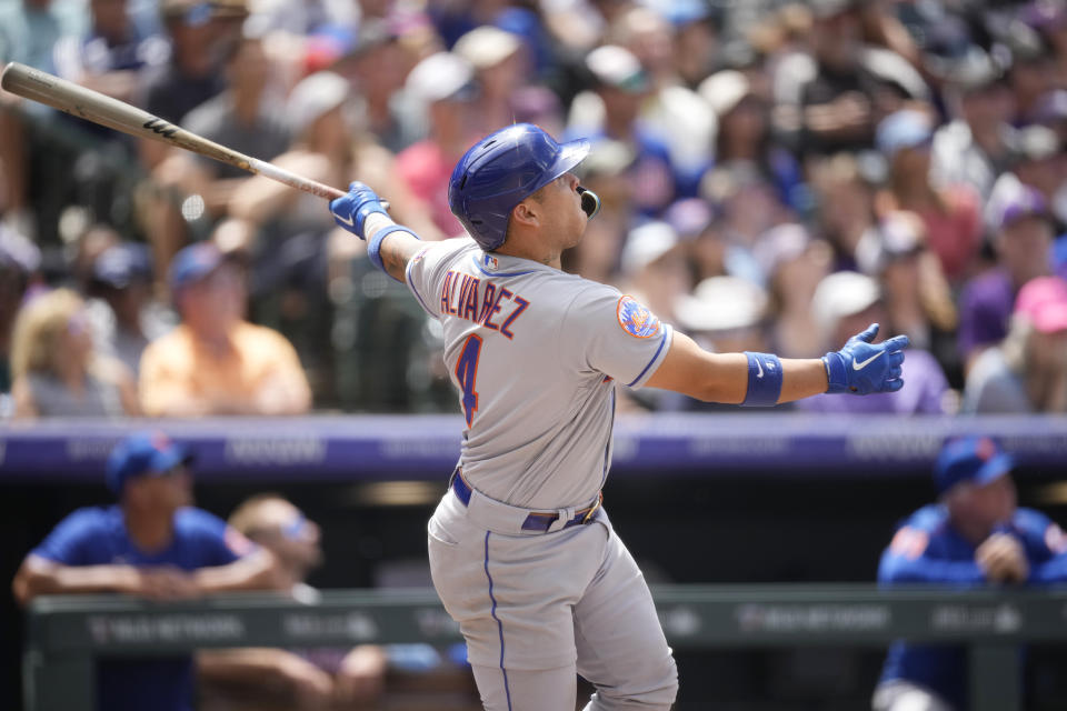 New York Mets' Francisco Alvarez follows the flight of his three-run home run off Colorado Rockies starting pitcher Austin Gomber in the fourth inning of a baseball game, Sunday, May 28, 2023, in Denver. (AP Photo/David Zalubowski)