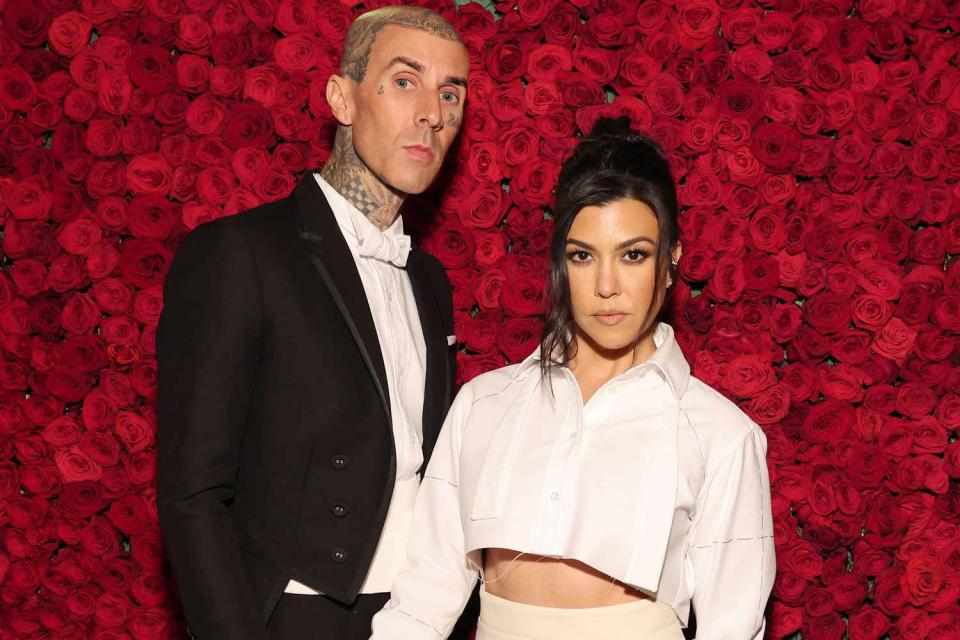 Cindy Ord/MG22/Getty Images for The Met Museum/Vogue Travis Barker and Kourtney Kardashian Barker