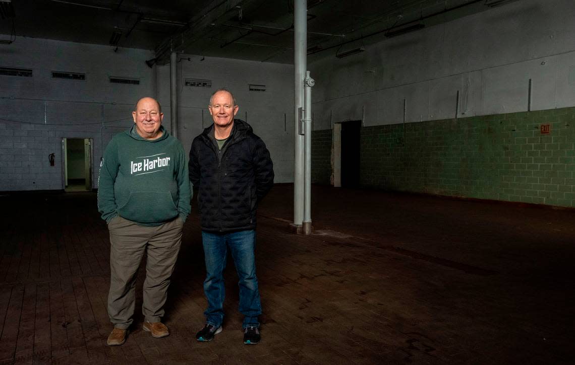 Mike Hall and Bill Jaquish, the co-owners of Ice Harbor Brewing Company, stand in part of the old Welch’s Grape Juice plant in downtown Kennewick. The building, which most recently housed JLieb Foods, Inc., will be the new flagship location of the Tri-Cities brewery.