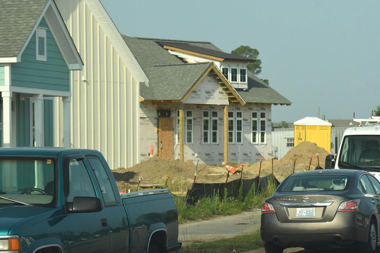 Construction crews continue to work on new homes and apartments along Westgate Drive in Leland. While there's opposition to the surge of development in Brunswick County, one nonprofit group says it's critical to continue growth.