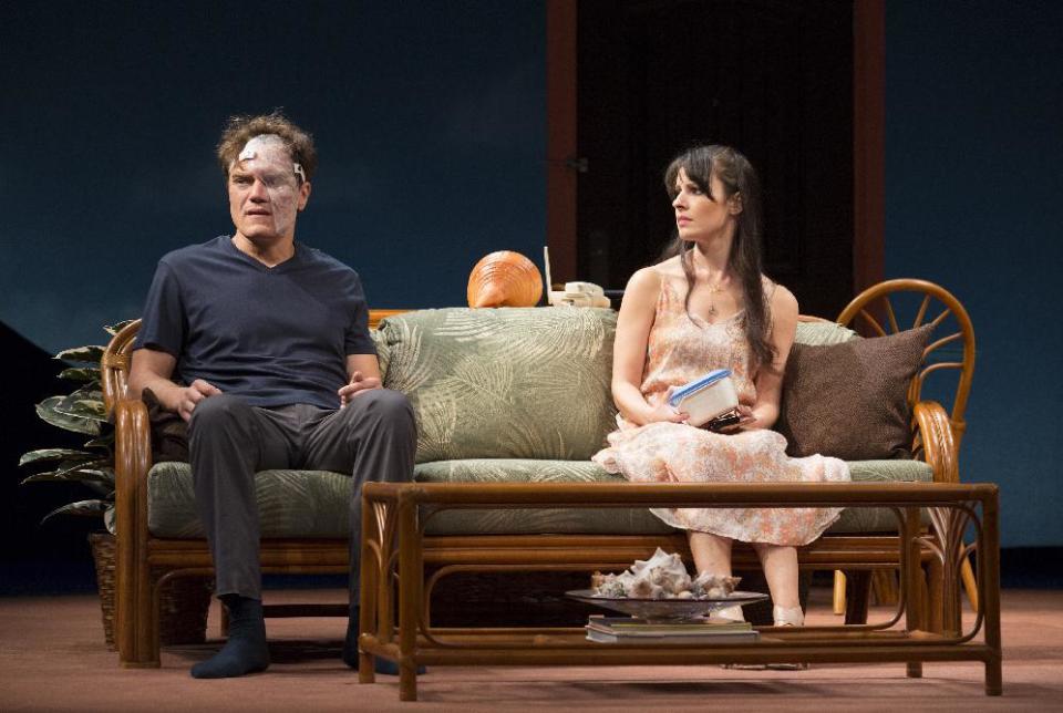 This theater image released by The O + M Company shows Michael Shannon, left, and Kate Arrington during a performance of "Grace," at the Cort Theatre in New York. (AP Photo/The O + M Company, Joan Marcus)