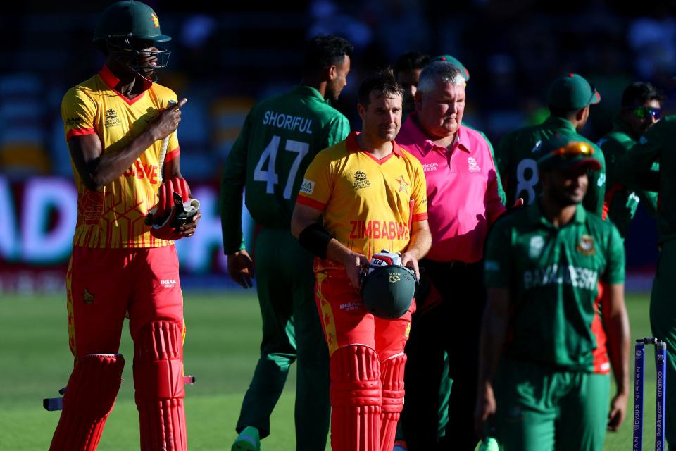 Zimbabwe's Ryan Burl and Blessing Muzarabani, pictured here walking off the field after their loss to Bangladesh.