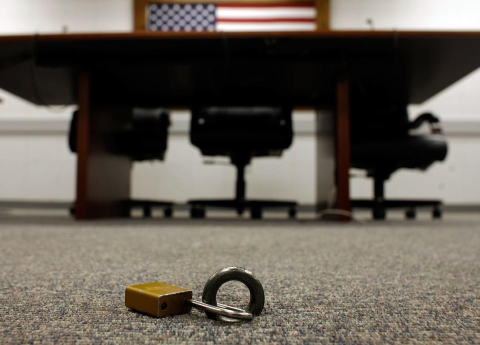 GUANTANAMO BAY, CUBA - OCTOBER 03:  IMAGE REVIEWED BY U.S. MILITARY PRIOR TO TRANSMISSION Detainees are padlocked to an eye-bolt in the floor when inside the Administrative Review Boards and Combatant Status Review Tribunals room inside the Camp Delta detention facility at the U.S. Naval Station at Guantanamo Bay October 3, 2007 in Guantanamo Bay, Cuba. Not technically a legal process, the tribunals "provide an annual review to assess whether the detainees held at Guantanamo Bay present a threat to the U.S. or its allies," according to the Office for the Administrative Review of the Detention of Enemy Combatants. Based on the tribunal's reccomendations, 199 detainees have been approved for release or transfer from Guantanamo. About 340 "enemy combatants" captured since the September 11, 2001 attacks on the United States continue to be held on the island.  (Photo by Chip Somodevilla/Getty Images)