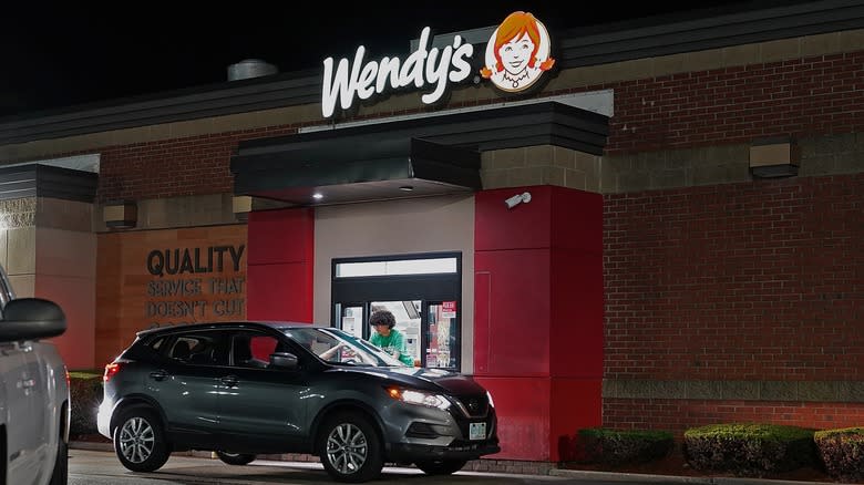 Car at Wendy's drive-thru nighttime