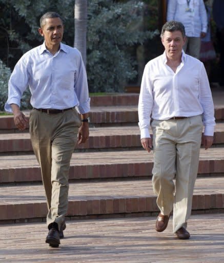 US President Barack Obama (L) and Colombian President Juan Manuel Santos arrive for a joint press conference in the framework of the VI Summit of the Americas at Casa de Huespedes in Cartagena, Colombia. Obama joined Santos and pop superstar Shakira at a ceremony to hand over land titles to descendants of Colombia's runaway African slaves