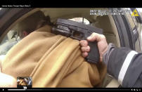 This photo taken from body cam video recorded Feb. 12, 2022, in Buffalo, N.Y., shows the hands of state trooper Anthony Nigro pointing his firearm at James Huber as he tells Huber to get out of his car. On Monday, June 5, 2023, Nigro was charged with manslaughter for fatally shooting Huber after a high-speed car chase. (Office of the State Attorney General of New York via AP)