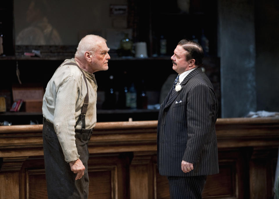 In this April 20, 2012, production photo provided by the Goodman Theatre in Chicago, actors Brian Dennehy, left, portraying one-time syndicalist-anarchist Larry Slade and Nathan Lane as Theodore “Hickey” Hickman perform in a scene in Eugene O’Neill’s "The Iceman Cometh" directed by Robert Falls. The epic drama runs through June 17. (AP Photo/Courtesy of The Goodman Theatre, Liz Lauren)