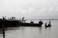 People arrive at a port from their villages in Dhubri district, in the northeastern state of Assam, India August 4, 2018. REUTERS/Adnan Abidi