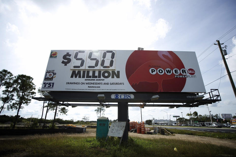 A sign showing the new Powerball jackpot amount stands beside US 1 highway in Homestead, Fla., Wednesday, Nob. 28, 2012. The Powerball jackpot has climbed to $550 million, the second-largest payout in U.S. history. Tickets are selling at a rate of 130,000 a minute nationwide. That's about six times the volume from a week ago. (AP Photo/J Pat Carter)