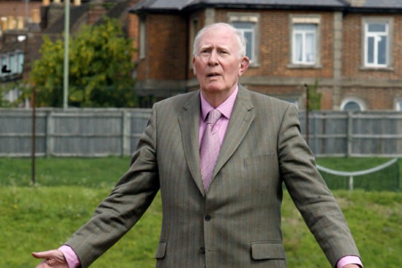 Legendary British athlete Sir Roger Bannister re-crosses the finish line at Oxford's Iffley Road Athletics Track on May 6, 2004, to mark the 50th anniversary of his record breaking, sub-4-minute mile. Bannister who was a 25-year-old Oxford University medical student at the time he ran his 3:59.4 mile, went on to live to age 88. File Photo by Hugo Philpott/UPI