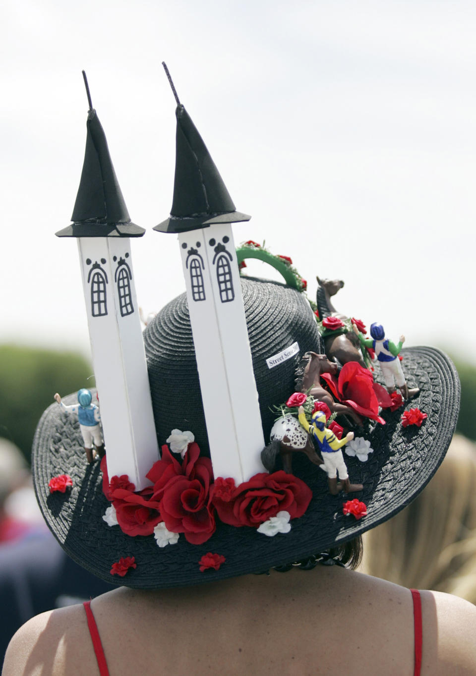 A race fan displays her hat before the derby on May 3, 2008.