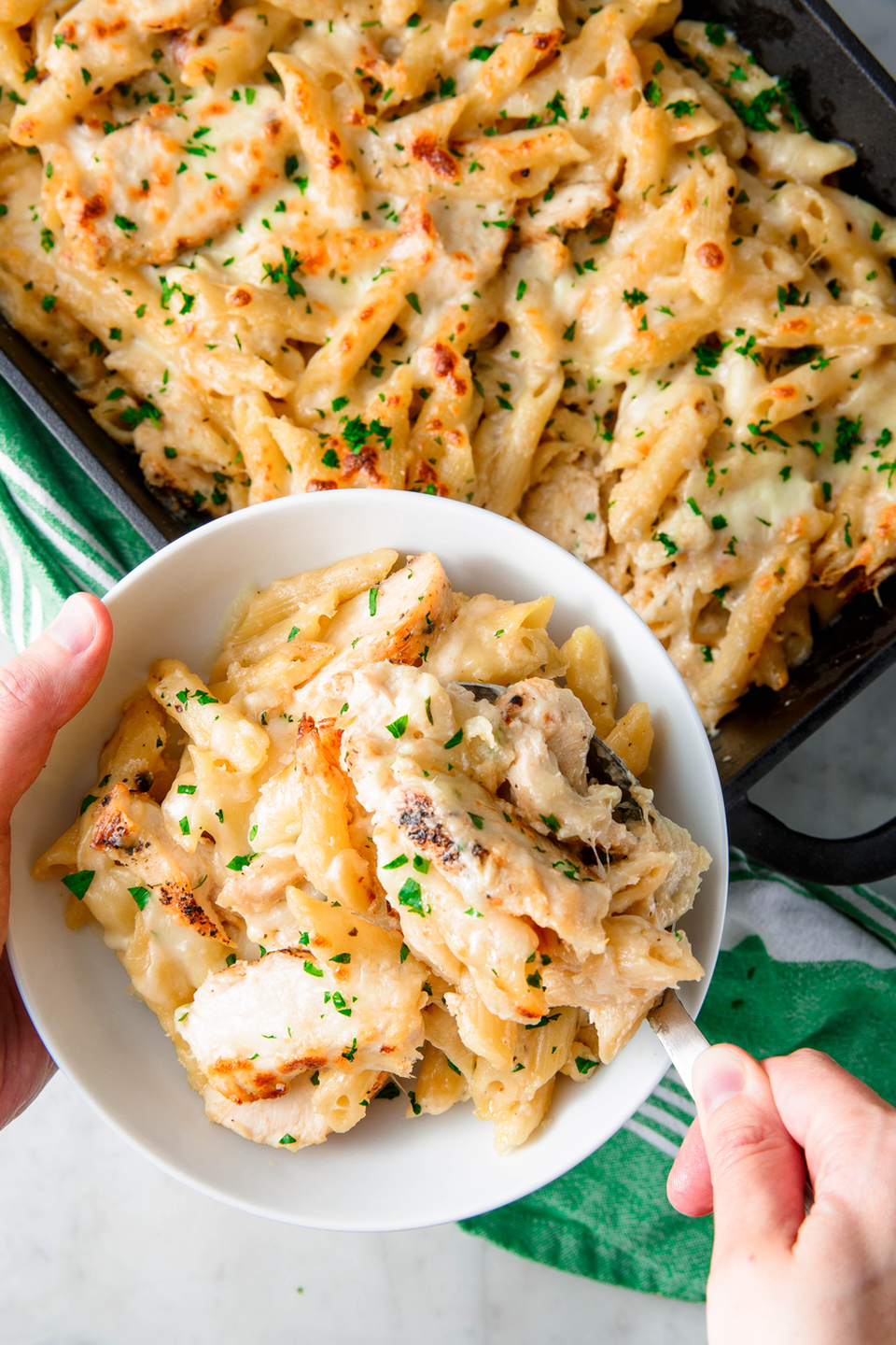 <p>Penne tossed with creamy alfredo sauce, chicken and (a lot) of mozzarella — need we say more?</p><p>Get the <a href="https://www.delish.com/uk/cooking/recipes/a29560066/chicken-alfredo-bake-recipe/" rel="nofollow noopener" target="_blank" data-ylk="slk:Chicken Alfredo Bake;elm:context_link;itc:0;sec:content-canvas" class="link ">Chicken Alfredo Bake</a> recipe.</p>