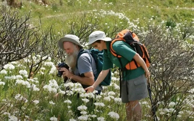 The couple out in the South African wilds backpacking the mountains seeking out seeds for the specialist mail order gardening firm - Pacific Bulb Society