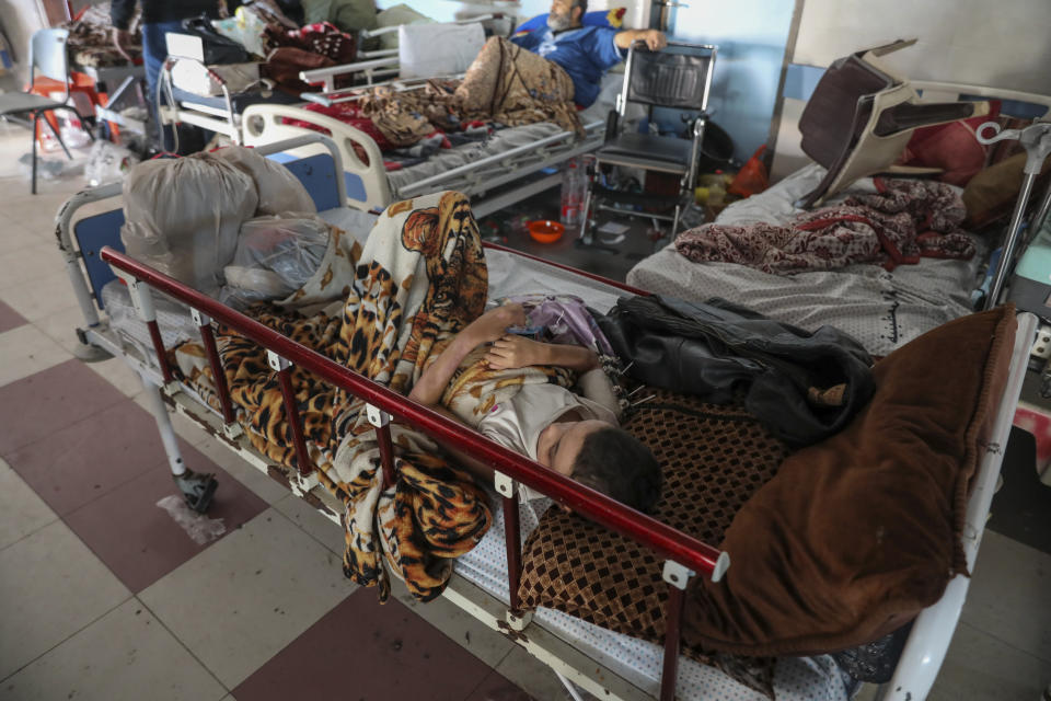 Wounded Palestinians lie in Shifa Hospital in Gaza City on Friday, Nov. 24, 2023, as the temporary ceasefire between Israel and Hamas took effect. (AP Photo/Mohammed Hajjar)