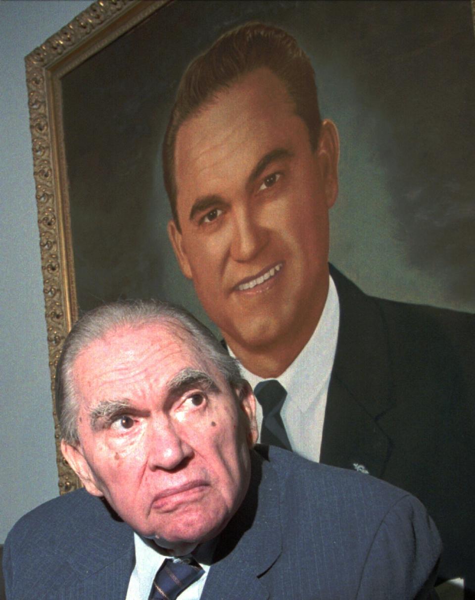 George C. Wallace is pictured in front of a painting of himself when he was governor during a visit to Montgomery on July 2, 1996. (AP Photo)