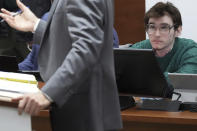 Marjory Stoneman Douglas High School shooter Nikolas Cruz looks up as one of his lawyers, capital defense attorney Casey Secor, makes an argument in court during jury selection in the penalty phase of his trial at the Broward County Courthouse in Fort Lauderdale on Monday, May 16, 2022. Cruz previously pleaded guilty to all 17 counts of premeditated murder and 17 counts of attempted murder in the 2018 shootings. (Amy Beth Bennett/South Florida Sun Sentinel via AP, Pool)