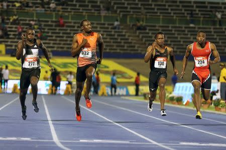 Athletics - Jamaica National Trials - Kingston - 01/07/16 (L-R) Jevaughn Minzie, Usain Bolt, Senoj-Jay Givans and Dexter Lee in action during men's 100m semi-final race. REUTERS/Gilbert Bellamy