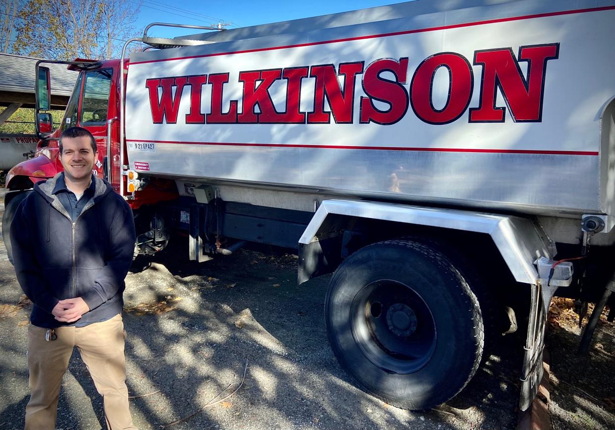 Matthew Wilkinson, general manager of Wilkinson Fuels and Propane in Somerset, is seen here with a home heating oil delivery truck.