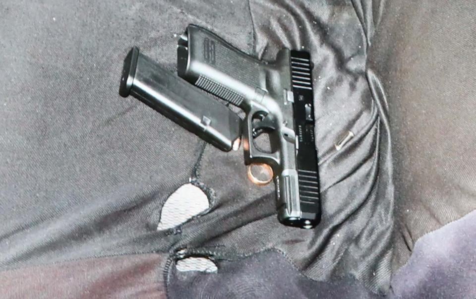 A still image by the Akron Police Department shows the gun they say was in the car of Jayland Walker, along with what appears to be a wedding band.