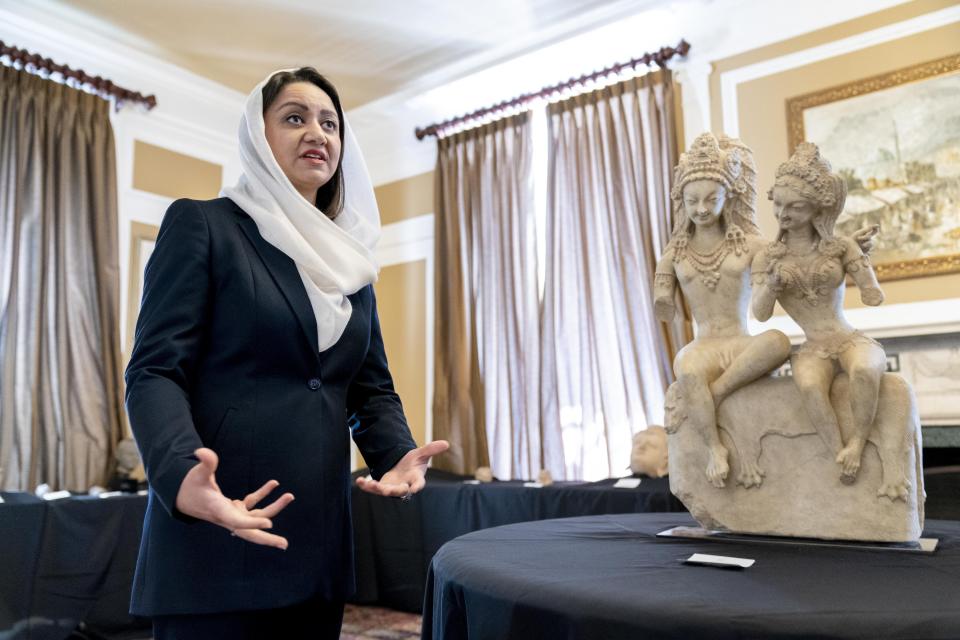 Afghan Ambassador to the U.S. Roya Rahmani speaks as she gives the Associated Press a tour at the Afghanistan Embassy in Washington, Wednesday, April 21, 2021, of looted and stolen Afghan religious relics and antiquities recovered by U.S. government authorities as part of a wider investigation into global trafficking in rare and ancient artifacts. (AP Photo/Andrew Harnik)