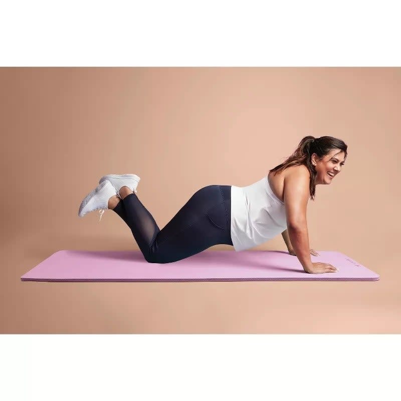 model using the pink yoga mat