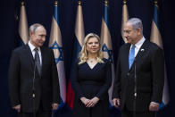 Israeli Prime Minister Benjamin Netanyahu and his wife Sarah stand with President Vladimir Putin at Netanyahu official residence in Jerusalem on January 23,2020 . Putin, will be a guest of honor Thursday at a ceremony at the Yad Vashem Holocaust Museum marking the 75th anniversary of the Soviet Red Army's liberation of the Nazi Auschwitz death camp. Presidents , prime ministers and royalty from around the world who arrived in Israel for the two-day World Holocaust Forum in Jerusalem, marking the 75th anniversary of the liberation of the Auschwitz-Birkenau concentration camp. (Heidi Levine/Pool photo via AP)