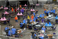 Maricopa County ballots cast in the 2020 general election are examined and recounted by contractors working for Florida-based company, Cyber Ninjas, Thursday, May 6, 2021 at Veterans Memorial Coliseum in Phoenix. The audit, ordered by the Arizona Senate, has the U.S. Department of Justice saying it is concerned about ballot security and potential voter intimidation arising from the unprecedented private recount of the 2020 presidential election results. (AP Photo/Matt York, Pool)