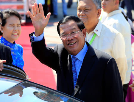 Cambodia's Prime Minister Hun Sen, waves to photographers upon arrival at the Manila International airport in Pasay city, metro Manila, Philippines April 28, 2017. REUTERS/Romeo Ranoco