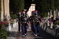 Monaco's honor guards arrive at a ceremony held to honor Josephine Baker at the Monaco-Louis II Cemetery in Monaco, Monday, Nov. 29, 2021. France is inducting Missouri-born cabaret dancer Josephine Baker who was also a French World War II spy and civil rights activist into its Pantheon. She is the first Black woman honored in the final resting place of France’s most revered luminaries. A coffin carrying soils from places where Baker made her mark will be deposited Tuesday inside the domed Pantheon monument overlooking the Left Bank of Paris. (AP Photo/Daniel Cole)