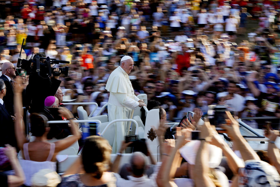 Pope Francis arrives at Rome's Circus Maximus to lead an evening prayer vigil with youths, Saturday, Aug. 11, 2018. Thousand of youths gathered for the meeting with the pontiff in preparation for the next World Youth Day that will be held in Panama next year. (AP Photo/Andrew Medichini)