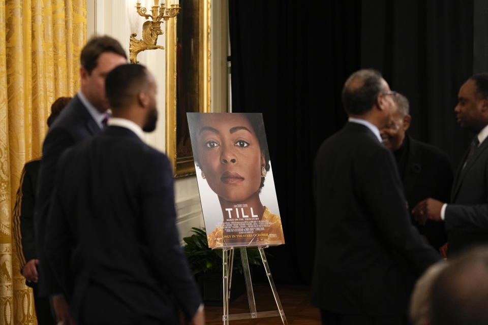 A movie poster for the film "Till" is displayed as people arrive for a screening of the movie in the East Room of the White House in Washington, Thursday, Feb. 16, 2023. The movie, "Till," is the story of Mamie Till-Mobley who pursued justice after the lynching of her 14-year-old son, Emmett Till, in 1955. (AP Photo/Susan Walsh)