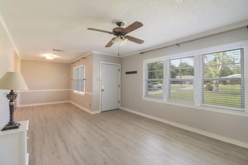 New flooring has been added in the living room, pictured, and breakfast room of this home listed for sale for $209,900 in the Bayou View subdivision of Gulfport.