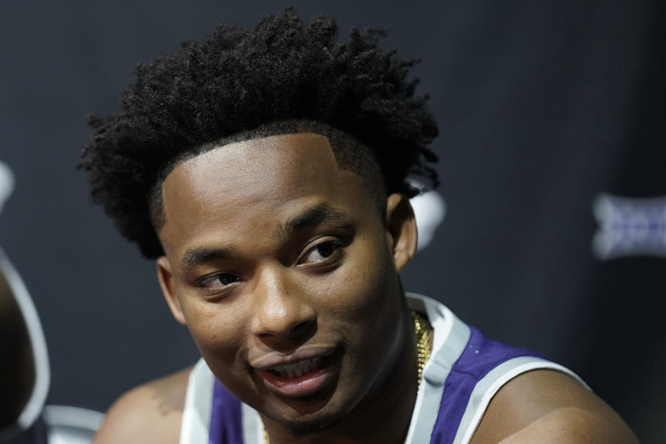 Kansas State's Tylor Perry speaks to the media during the NCAA college Big 12 men's basketball media day Wednesday, Oct. 18, 2023, in Kansas City, Mo. (AP Photo/Charlie Riedel)
