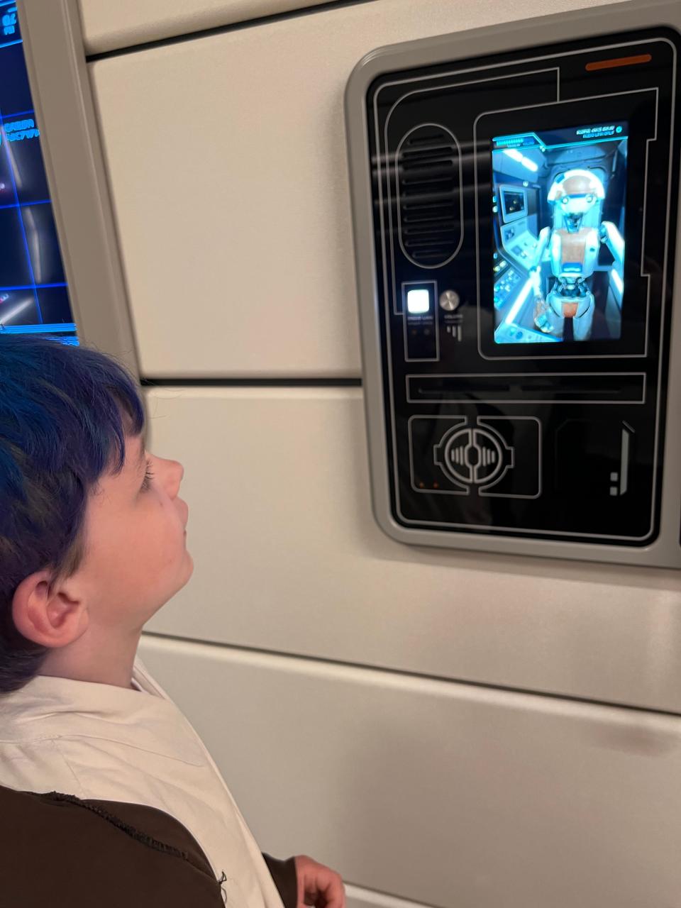 My son talking to the droid panel in the wall