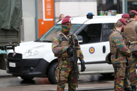 Belgian soldiers take up position outside the City2 shopping complex which was evacuated following a bomb scare in Brussels, Belgium, June 21, 2016. REUTERS/Francois Lenoir