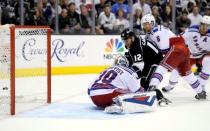 Jun 13, 2014; Los Angeles, CA, USA; Los Angeles Kings right wing Marian Gaborik (12) scores a goal past New York Rangers goalie Henrik Lundqvist (30) and defenseman Anton Stralman (6) during the third period in game five of the 2014 Stanley Cup Final at Staples Center. Mandatory Credit: Gary A. Vasquez-USA TODAY Sports