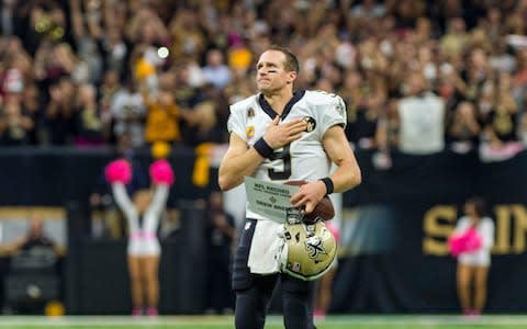 Drew Brees thanks the fans after breaking the NFL record for passing yards as The New Orleans Saints take on The Washington Redskins during Monday Night Football at the Mercedes-Benz Superdome - Credit: (The Daily Advertiser via AP)