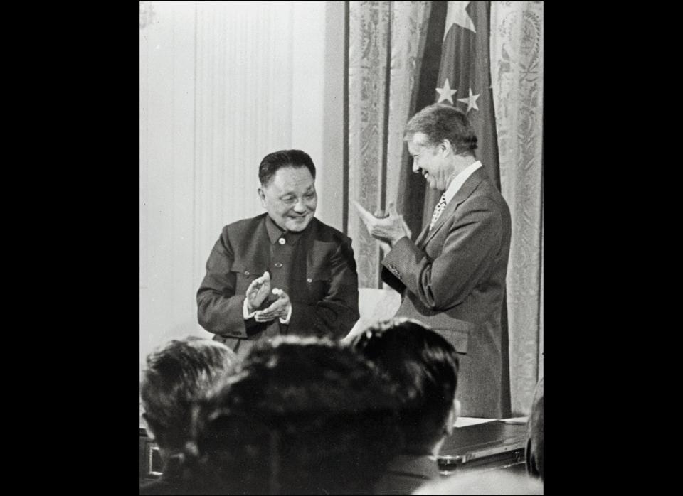 Chinese Vice Premier Deng Xiaoping is shown in a a photo dated Jan. 31, 1979 applauding with President Carter after signing three agreements for Sino-U.S. cooperation in Science and Technology, Culture and Consular Affairs in a ceremony in the East Room of the White House.