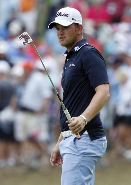 Bernd Wiesberger, one stroke behind leader Rory McIlroy, watches his putt on the 14th hole Saturday. (AP Photo)