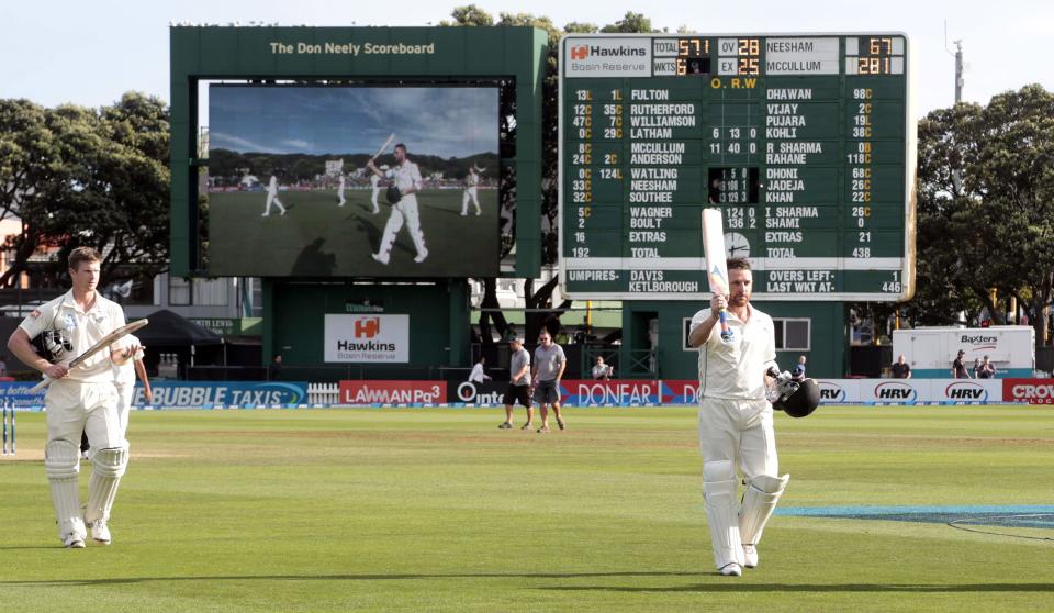 New Zealand's Brendon McCullum (R) leaves the field on 281 not out against India, ahead of teammate James Neesham, during the second innings at the end of play on day four of the second international test cricket match at the Basin Reserve in Wellington, February 17, 2014.