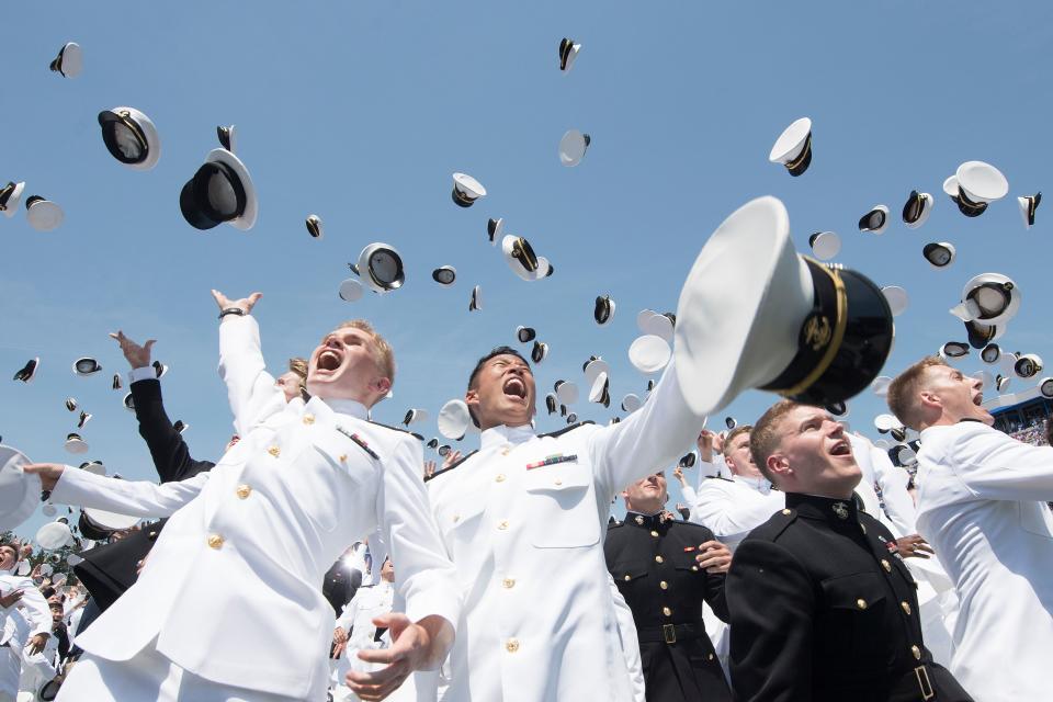 <p>U.S. Naval Academy midshipmen celebrate during their graduation ceremony in Annapolis, Md., on May 25, 2018. (Photo: Jim Watson/AFP/Getty Images) </p>